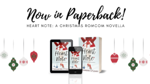Now in paperback! Heart Note: A Christmas Romcom Novella. Image of 3D book and ereader with Christmas decorations.